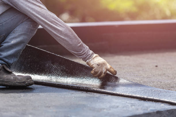 Professional Waterproofing technician working in Glenwood Landing, NY